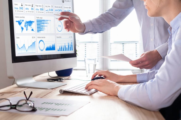 Blog 5 Team of business people discussing digital marketing metrics report and return on investment strategy for advertisement campaign