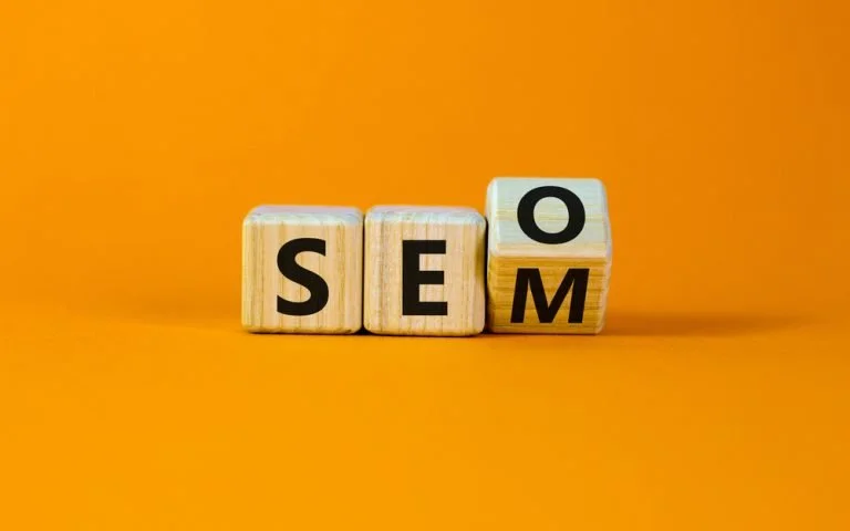Blog 5 Wooden cubes turning and showing SEO and SEM