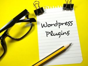 WordPress Plugins written on a notepad.