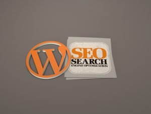 Image featuring the WordPress logo on the left, styled in orange, and a graphic to the right with the text 'SEO Search Engine Optimization' in bold orange and black lettering, placed on a light gray background with various internet-related icons.
