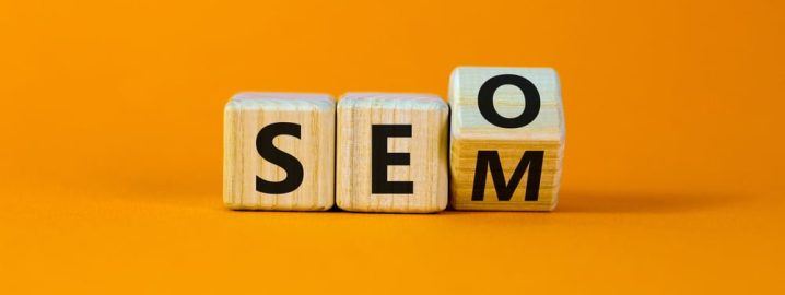 Wooden cubes turning and showing SEO and SEM