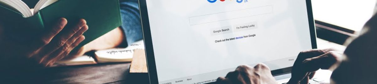 Man Using Laptop Browsing Google Website