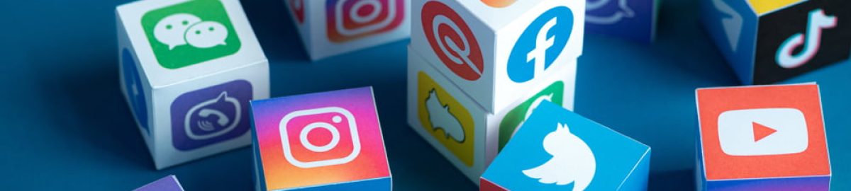 Different social media platform logos on cubes.