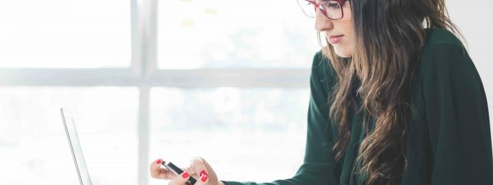 woman working on website conversion optimisation woman working on website optimisation