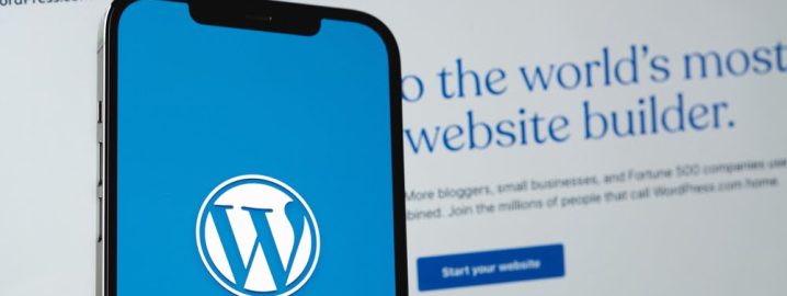 WordPress,Logo,Mobile,App,On,Screen,Smartphone,Iphone,With,Macbook Simple WordPress website on computer screen.