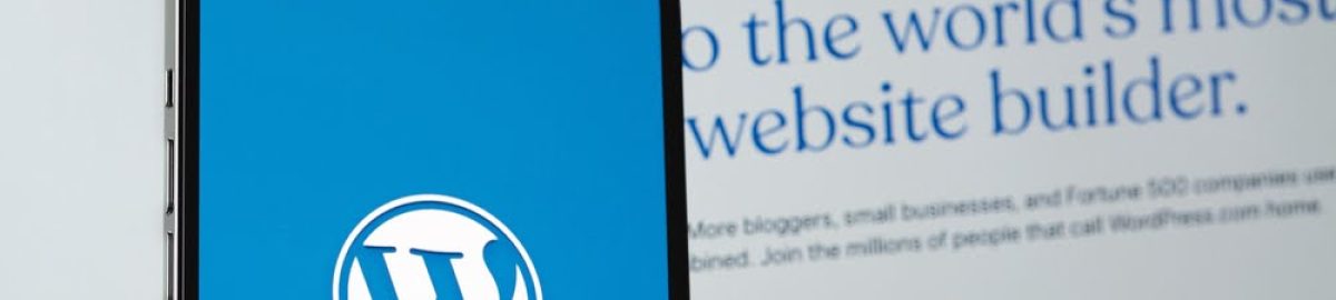 WordPress,Logo,Mobile,App,On,Screen,Smartphone,Iphone,With,Macbook Simple WordPress website on computer screen.